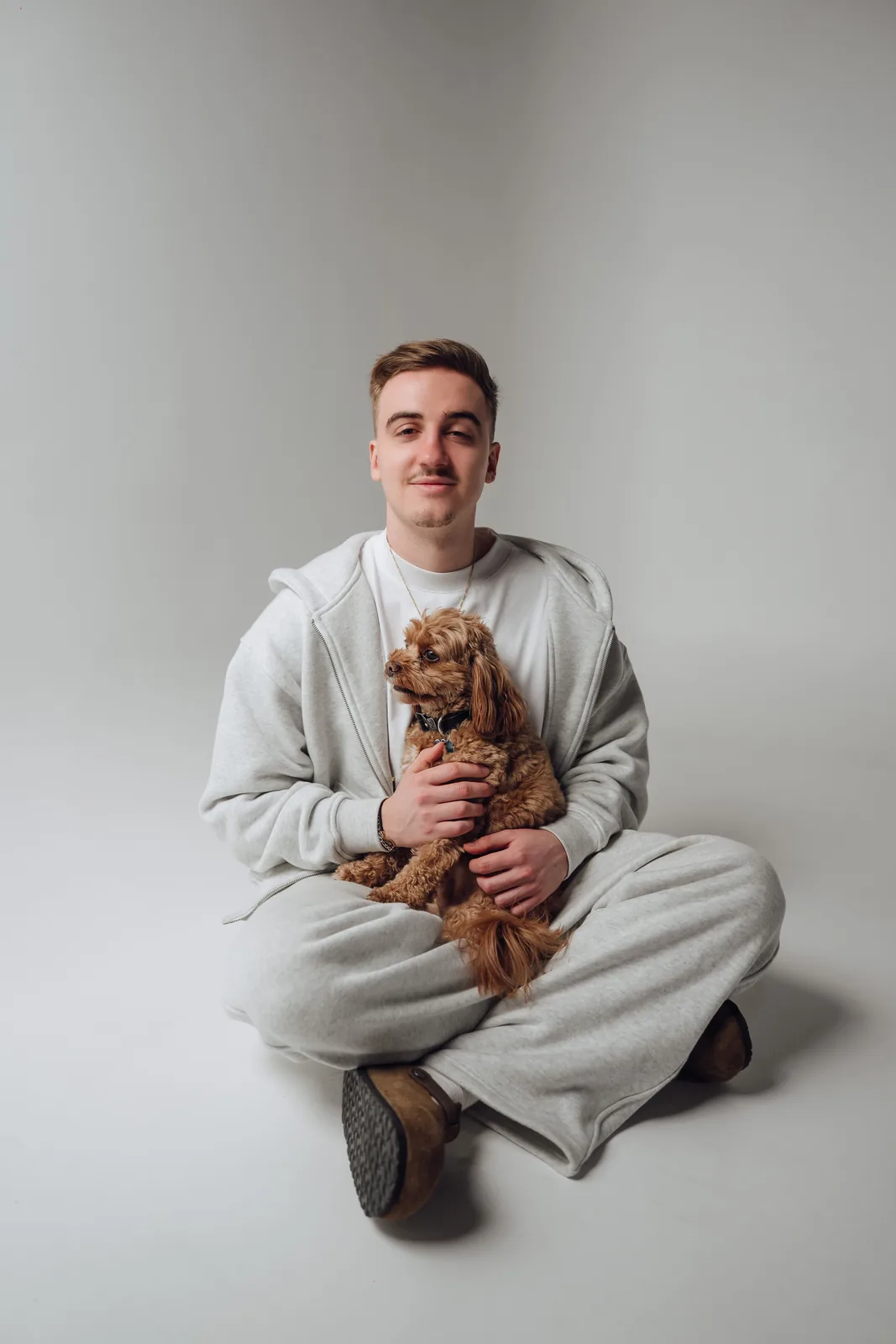 Milo the dog and owner together during a studio photography session