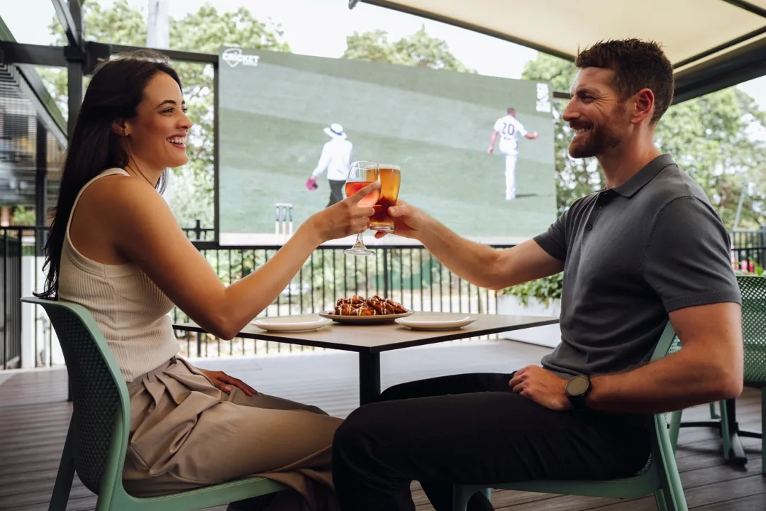 Guests toasting drinks, The M1 Group
